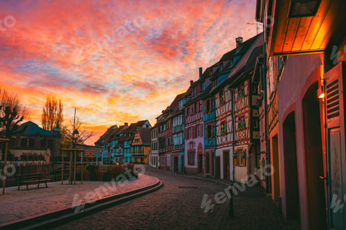 Preview: Colmar empty canal at sunrise with fire-orange sky and dark facades in Alsace France