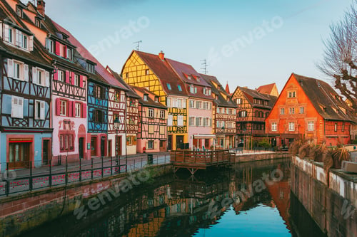 Preview: Colmar old town doorway at dawn with warm light and ancient stonework in Alsace France