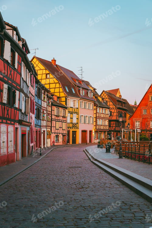 Preview: Scenic bridge over Colmar canal at dawn with colorful sky reflection in Alsace France