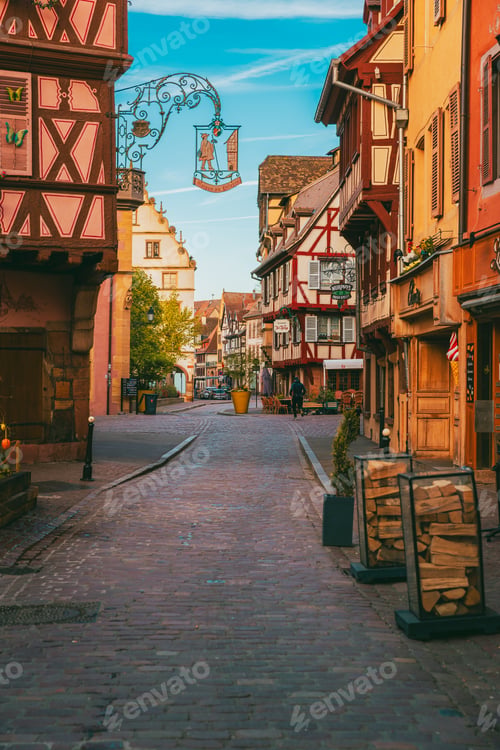 Preview: Narrow medieval alley with traditional timber framed buildings in Colmar