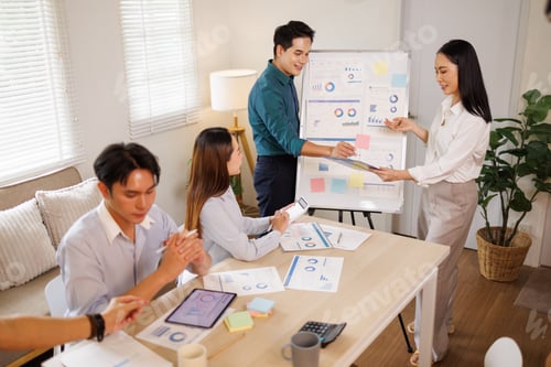 Preview: Business colleagues collaborating on strategy and data analysis