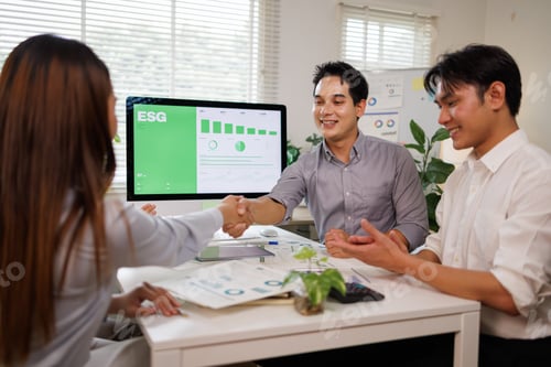 Preview: Business partners shaking hands discussing esg investment strategy