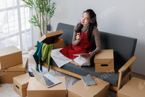Preview: Asian woman thinking managing her online small business