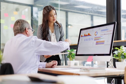 Preview: Business colleagues collaborating on a data analytics project, brainstorming strategies and reviewin
