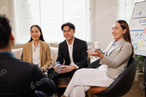 Preview: Asian business people discussing strategy during office meeting