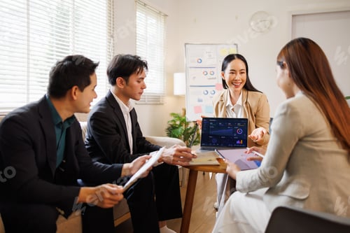 Preview: Business team analyzing data during marketing presentation meeting