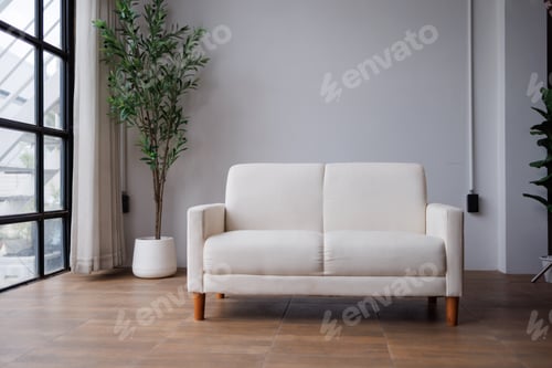 Preview: White two-seater sofa standing in modern minimalist living room providing comfortable and stylish se