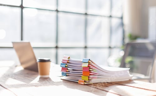 Preview: Many folders with documents and laptop on wooden desk,