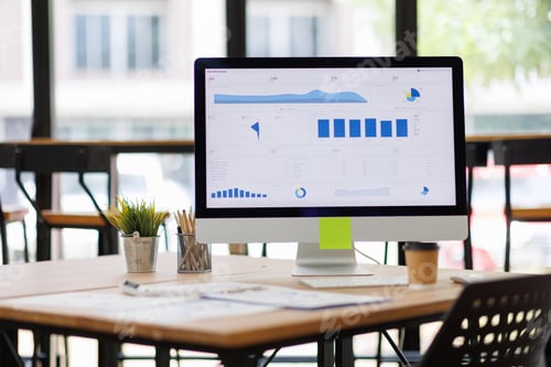Preview: Computer monitor displaying business data analysis dashboard at office