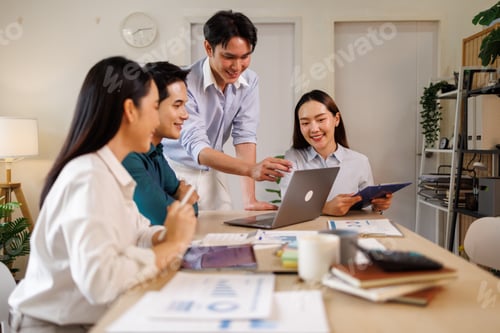 Preview: Business team collaborating on startup project using laptop