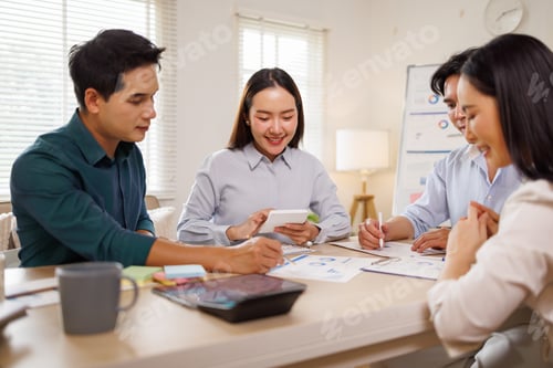 Preview: Asian business team collaborating on business strategy and finance
