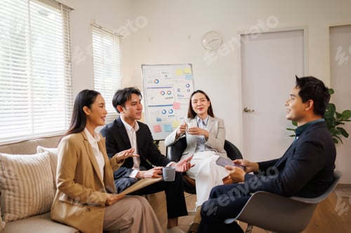 Preview: Business team collaborating during casual meeting in office