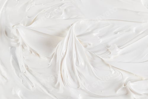 Preview: Snow-white texture of buttercream with beautiful curls and cones. top view. selective focus. culinar