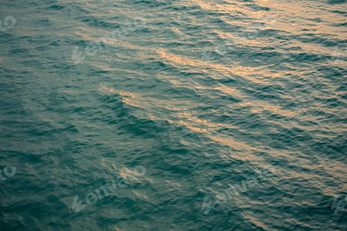 Preview: Blue Ocean Surface with Gentle Waves and Soft Evening Light