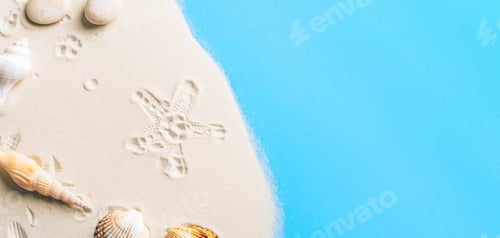 Preview: Seashells and starfish on sandy beach with blue water. Top view, flat lay, copy space
