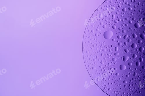 Preview: Water drops on glass slide, forming an abstract purple pattern