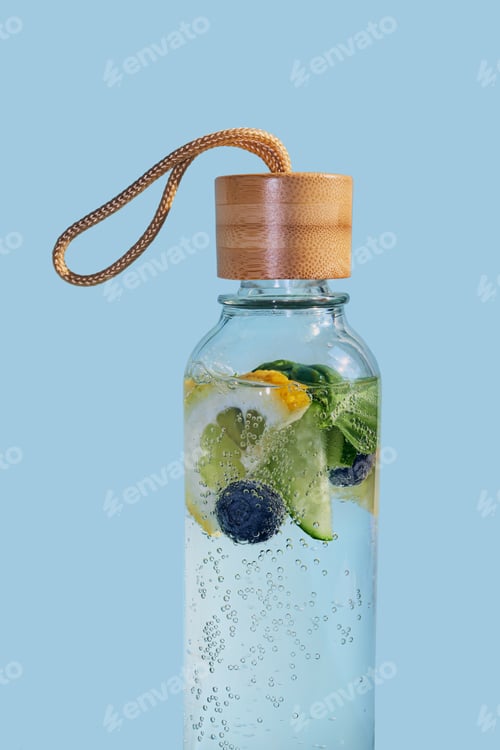 Preview: Glass bottle holding refreshing fruit infused water with bamboo lid