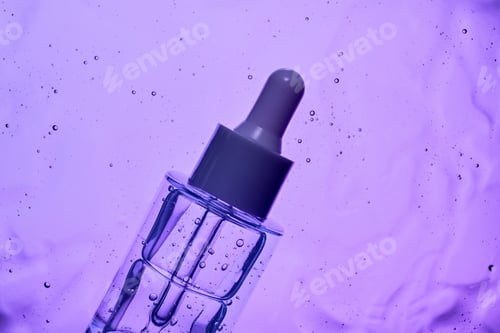 Preview: Clear cosmetic serum bottle on spilled serum background, purple light