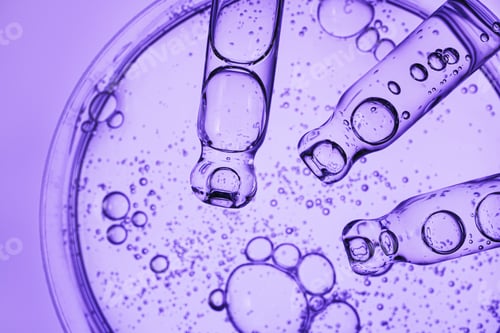 Preview: Cosmetic liquid with bubbles in science laboratory for beauty product development