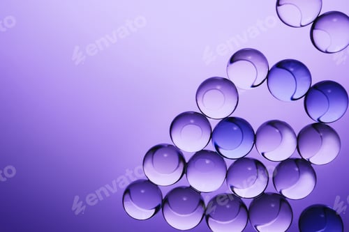Preview: Translucent spheres creating an abstract pattern with light refractions on vibrant purple background