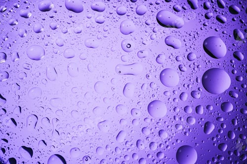 Preview: Water drops of various sizes creating an abstract background texture