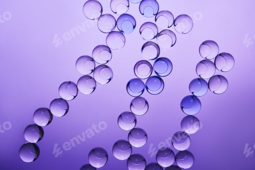 Preview: Clear and blue spheres forming an abstract chains on gradient purple surface