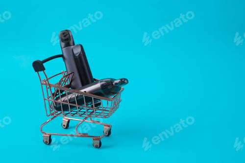 Preview: Collection Of Electronic Cigarettes In Miniature Shopping Cart