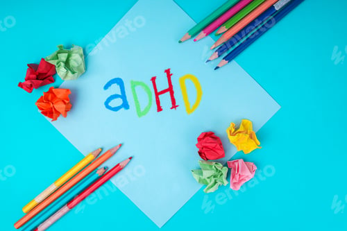 Preview: Flat Lay Of ADHD Letters On Paper With Crushed Paper Symbolizing Neurodiversity