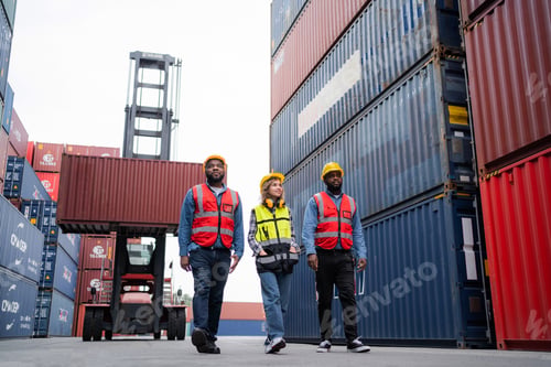 Preview: A team of logistics engineers, workers and container yard managers wear helmets. Works in industrial