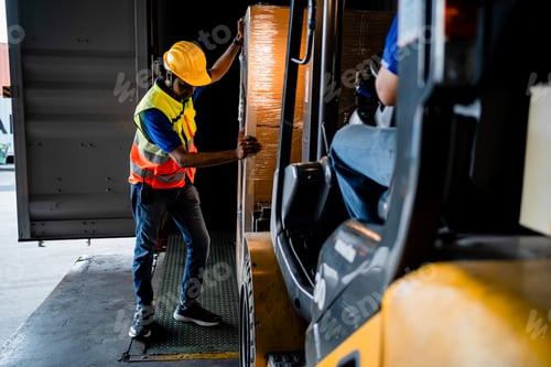 Preview: Male Warehouse Worker Performing Forklift Safety Inspection Before Operation