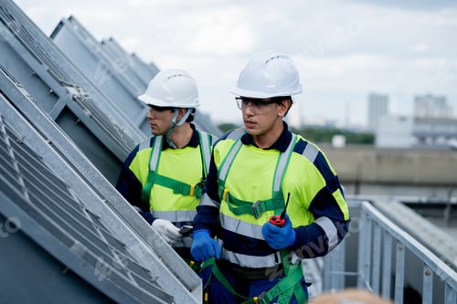 Preview: HVAC Engineers Inspecting Industrial Ventilation System on Commercial Building Rooftop. HVAC mainte
