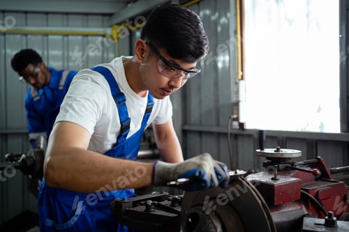 Preview: Turning engineer working in industrial factory. industrial plant concept Factory engineer. industria