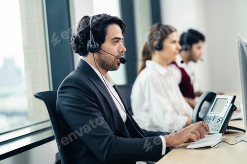 Preview: Beautiful woman using headset and computer in modern office. Technical support staff for telephone r