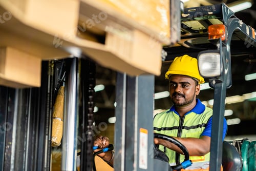 Preview: Confident Forklift Operator Portrait in Warehouse Environment.