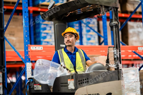 Preview: Skilled Forklift Driver Operating Machinery Inside Warehouse. Material Handling, Logistics Operatio