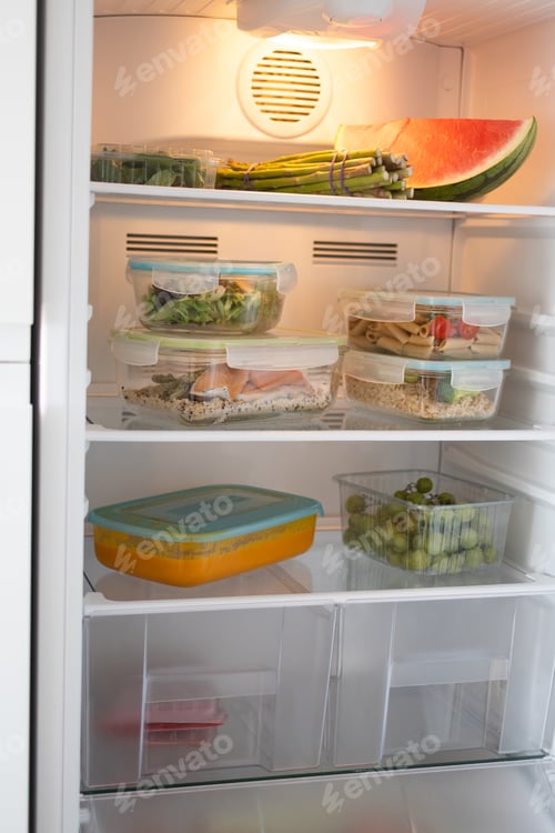 Preview: Organized Refrigerator with Healthy Meal Prep Containers and Fresh Food