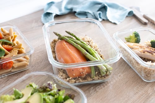 Preview: Healthy meal prep containers with salmon, chicken, pasta and fresh vegetables