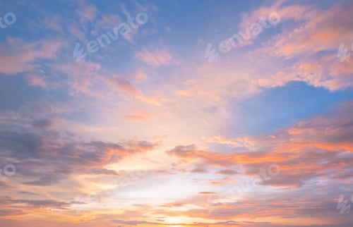 Preview: Soft pastel clouds glow with sunset's warmth