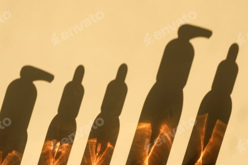 Preview: Shadows form from skincare bottles under bright light