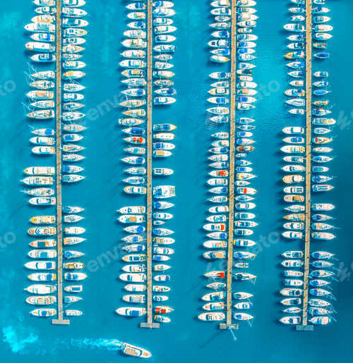 Preview: Aerial view of boats and yachts in dock at sunset in summer