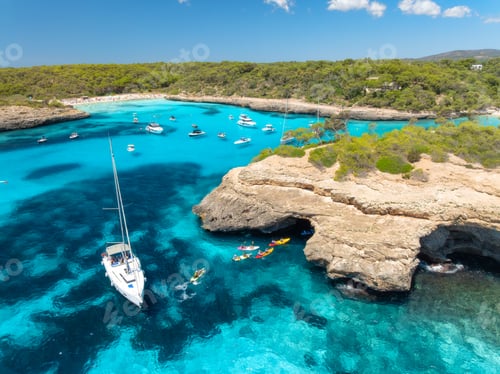 Preview: Aerial drone view of yachts and boats in turquoise sea bay