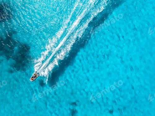Preview: Aerial drone view of floating speed boat in blue sea on sunny day