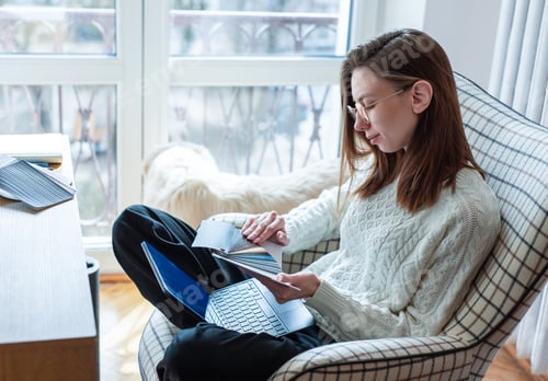 Preview: Woman choosing color swatches for home interior design project