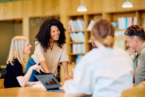 Preview: Diverse business team collaborating during a meeting