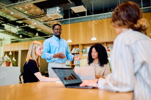 Preview: Diverse business team collaborating during office meeting presentation