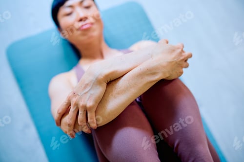 Preview: Woman finding tranquility and peacefulness during yoga