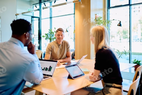 Preview: Diverse team collaborating during an office business meeting