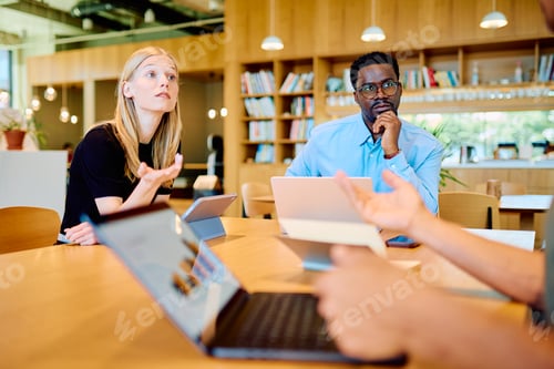 Preview: Diverse business team collaborating during an office meeting