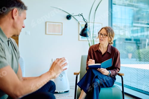 Preview: Psychologist counseling client during therapy session