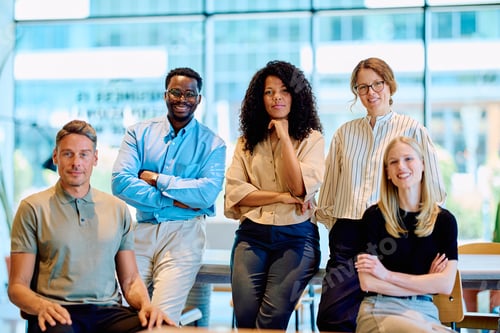 Preview: Diverse business team smiling working in modern office